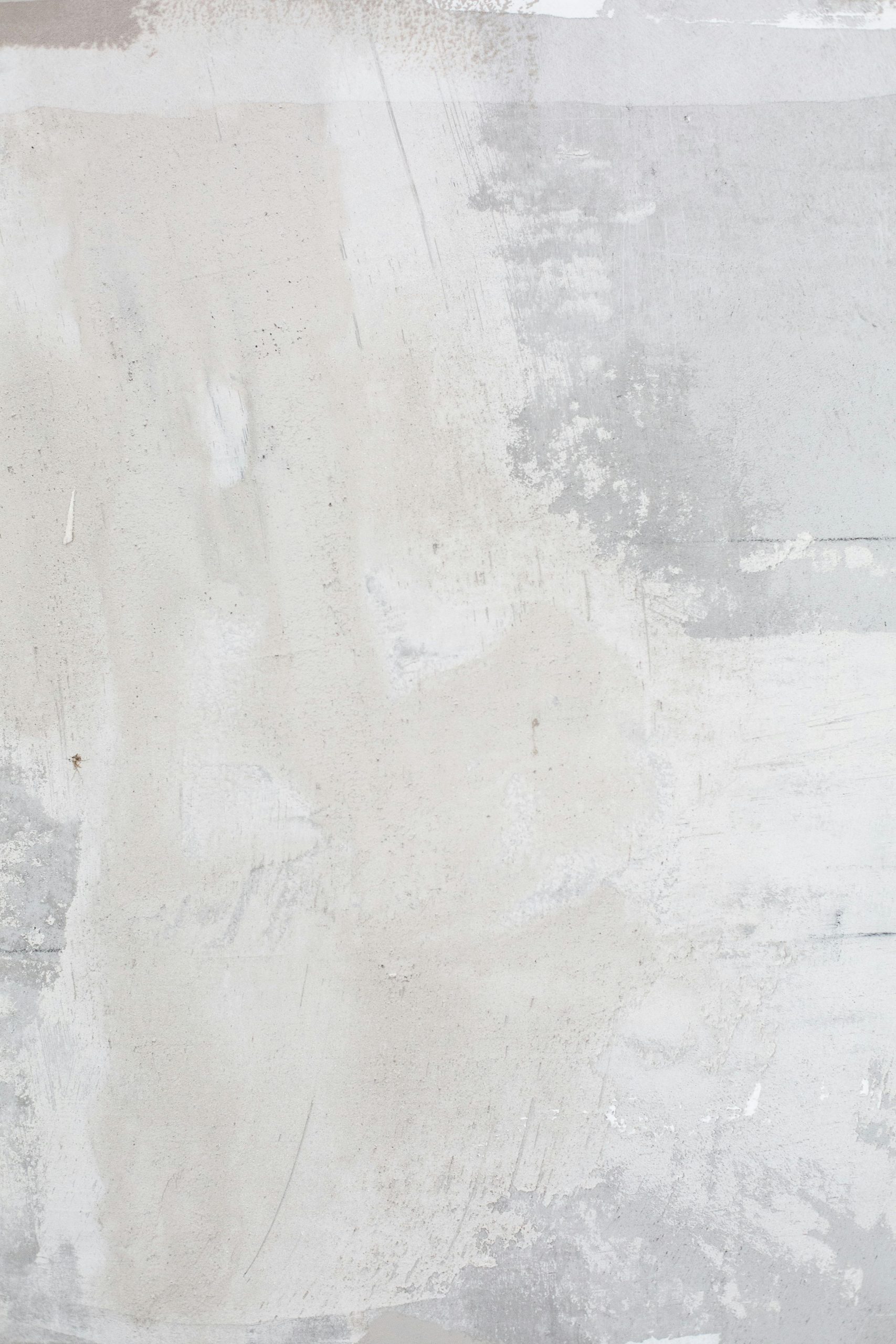 High-resolution image of an abstract textured wall with white and gray tones, perfect for backgrounds and design projects.